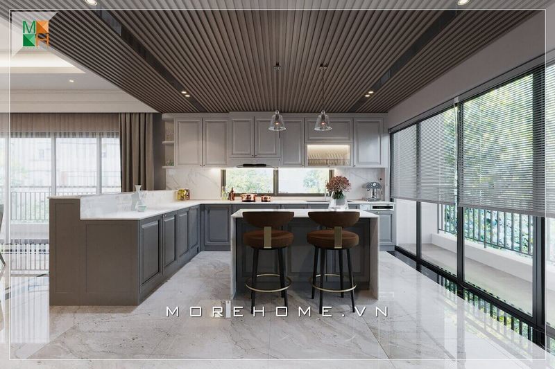 Ấn tượng với mẫu thiết kế phòng bếp không gian mở, với hệ thống tủ bếp và bàn đảo bếp bằng gỗ kết hợp mặt bàn đá nhân tạo cao cấp, lấy ánh sáng từ hệ thống cửa kính ban công cánh trượt, vừa tạo sự thông thoáng cho không gian mà phòng bếp của bạn sẽ luôn khô ráo sạch sẽ nhờ nguồn ánh sáng mặt trời tự nhiên